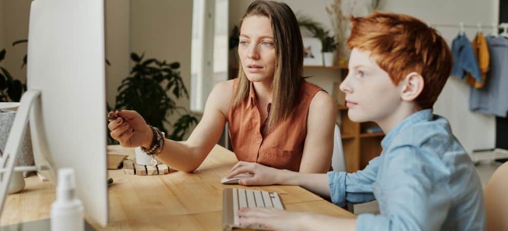 Mother interactively teaching Spanish to her son