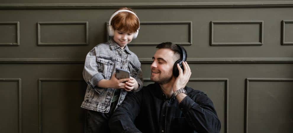 Dad and son listening to Spanish songs for kids