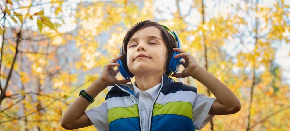 child listening to spanish songs for kids
